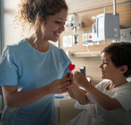 A medical professional giving a child a lollipop