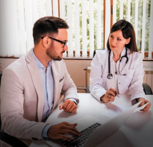 Two medical professionals working together at a table