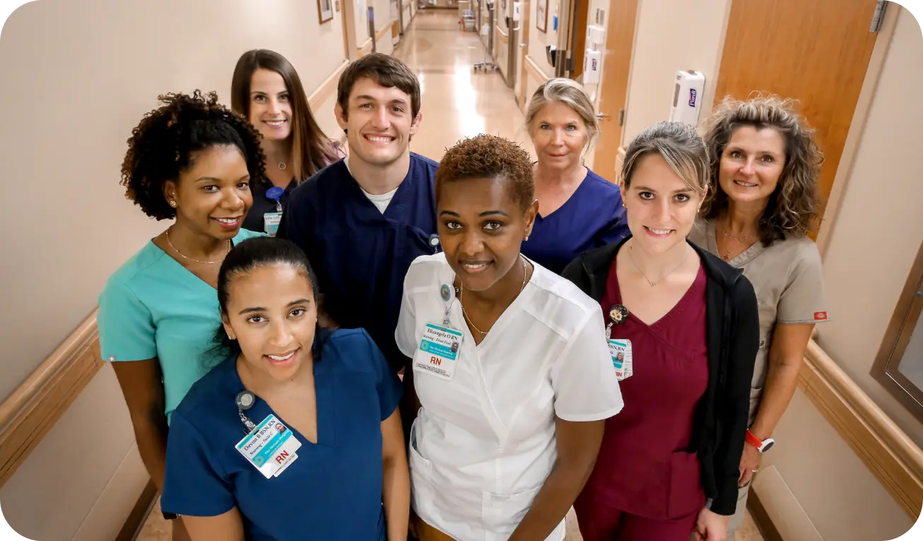 A group of Brown University Health professionals smiling.