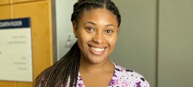 A Brown University Health nurse smiling.