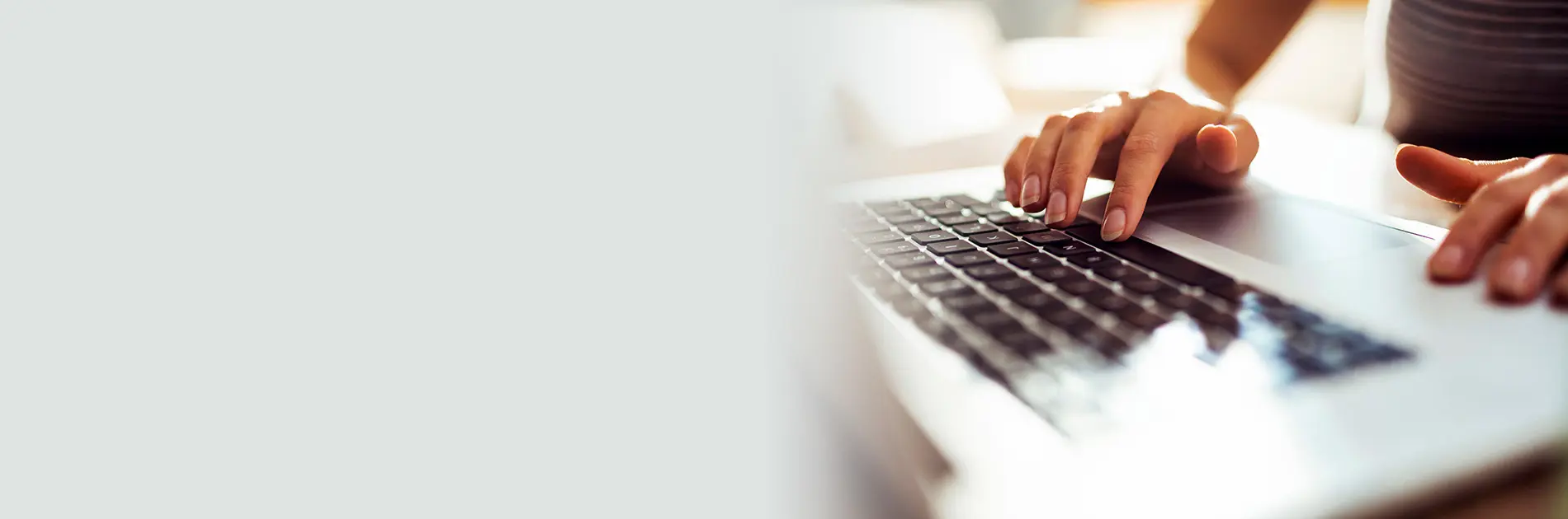 An applicant types on a keyboard to begin applying for a position at CareSource.