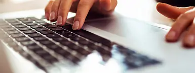 An applicant types on a keyboard to begin applying for a position at CareSource. (Mobile)