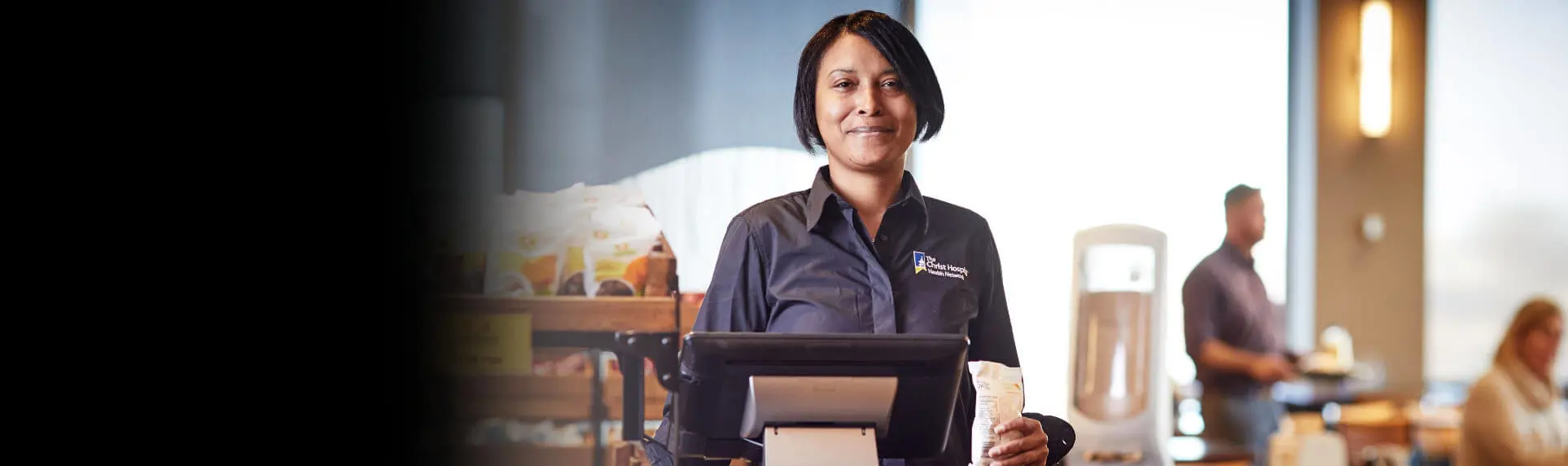 A Christ Hospital employee smiling with the headline: “Everything it takes so everyone can flourish”