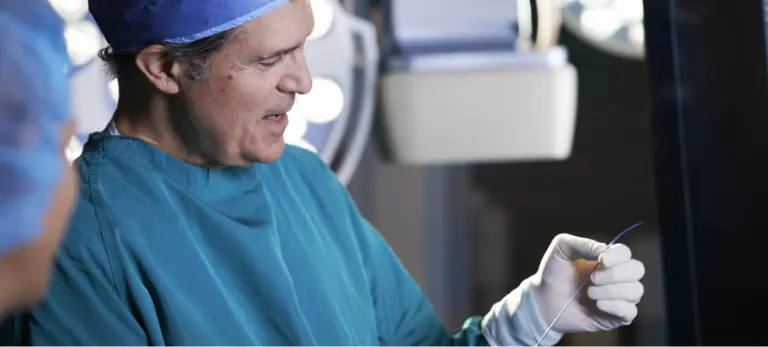 A Christ Hospital Health Network employee evaluating medical equipment.