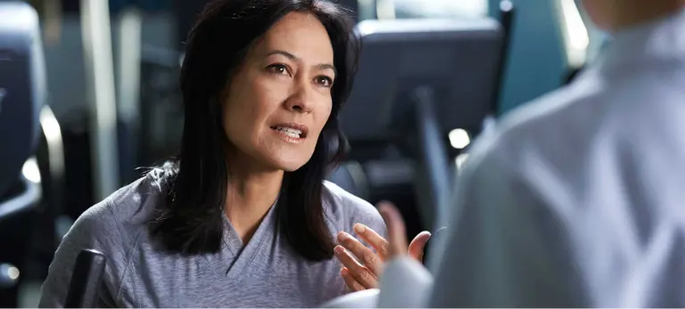 A Christ Hospital Health Network employee talking to a patient.