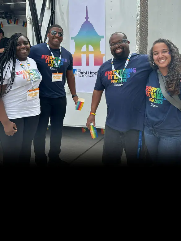 A group of diverse Christ Hospital employees smiling with the headline: “Everything is takes so everyone can connect”