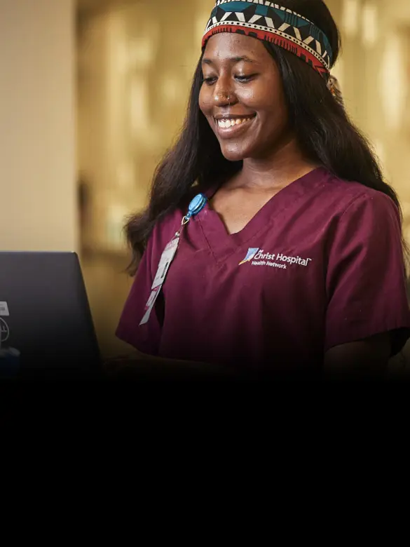 A Christ Hospital Health Network employee smiling with the headline: 'Everything it takes so everyone can grow'