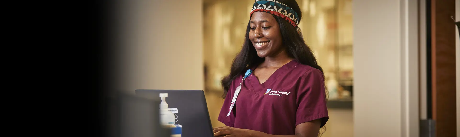 A Christ Hospital Health Network employee smiling with the headline: 'Everything it takes so everyone can grow'