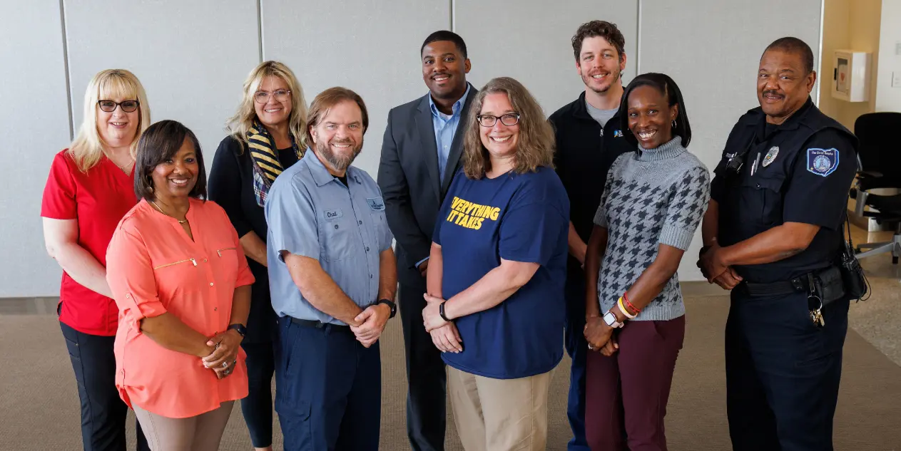 A group of Christ Hospital Health Network employees smiling.