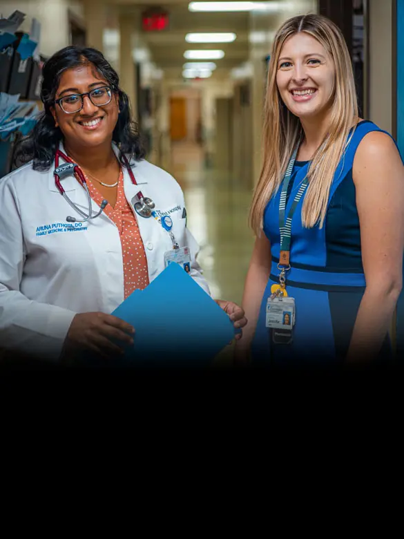 Two Christ Hospital medical professionals smiling with the headline: “Everything it takes so everyone can excel”