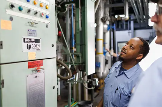 A facilities operator looking at equipment