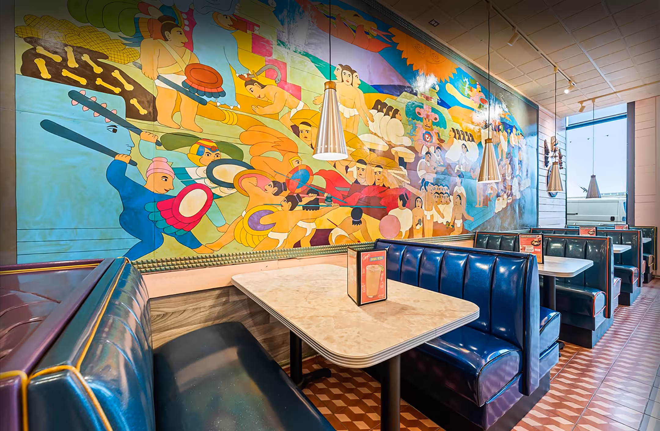 A backdrop photo of the interior of a Chuy’s restaurant.
