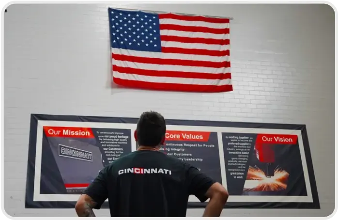 A veteran employee admiring an American flag at Cincinnati Incorporated.