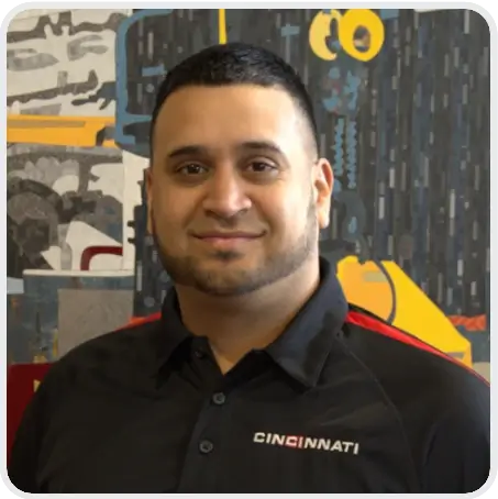 A Cincinnati Incorporated employee smiling.