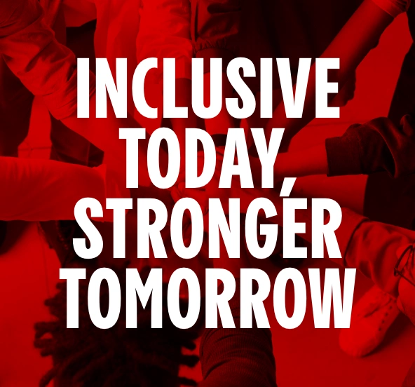 Cinemark employees' hands stacked in a team huddle.