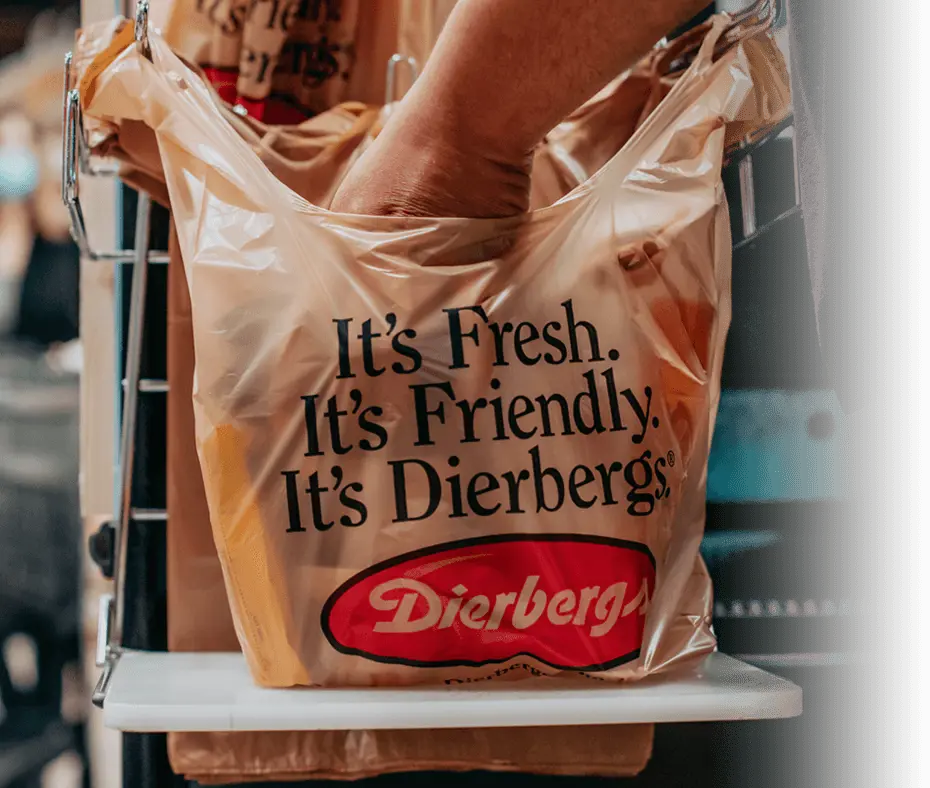 A plastic shopping bag is being filled with purchases at Dierbergs.
