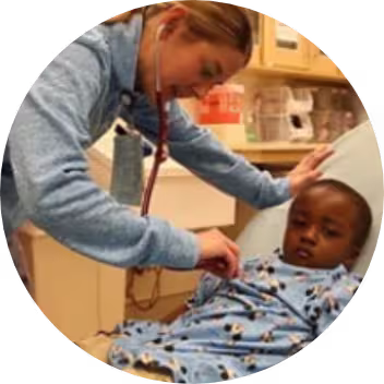 A Dierbergs associate helping a sick child