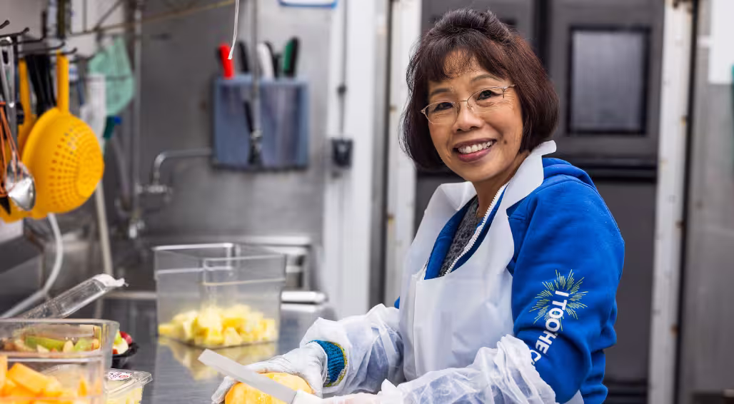 A Dierbergs produce associate smiling