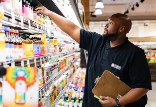Dierbergs associate in front of the store