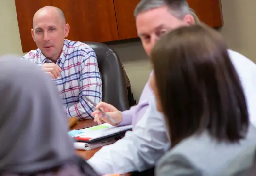A manager provides directions to two employees inside a Dierbergs' store.