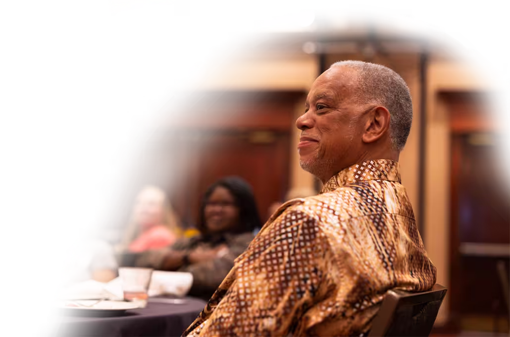A smiling Dierbergs associate sitting at an awards ceremony