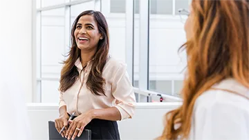 A woman smiling.