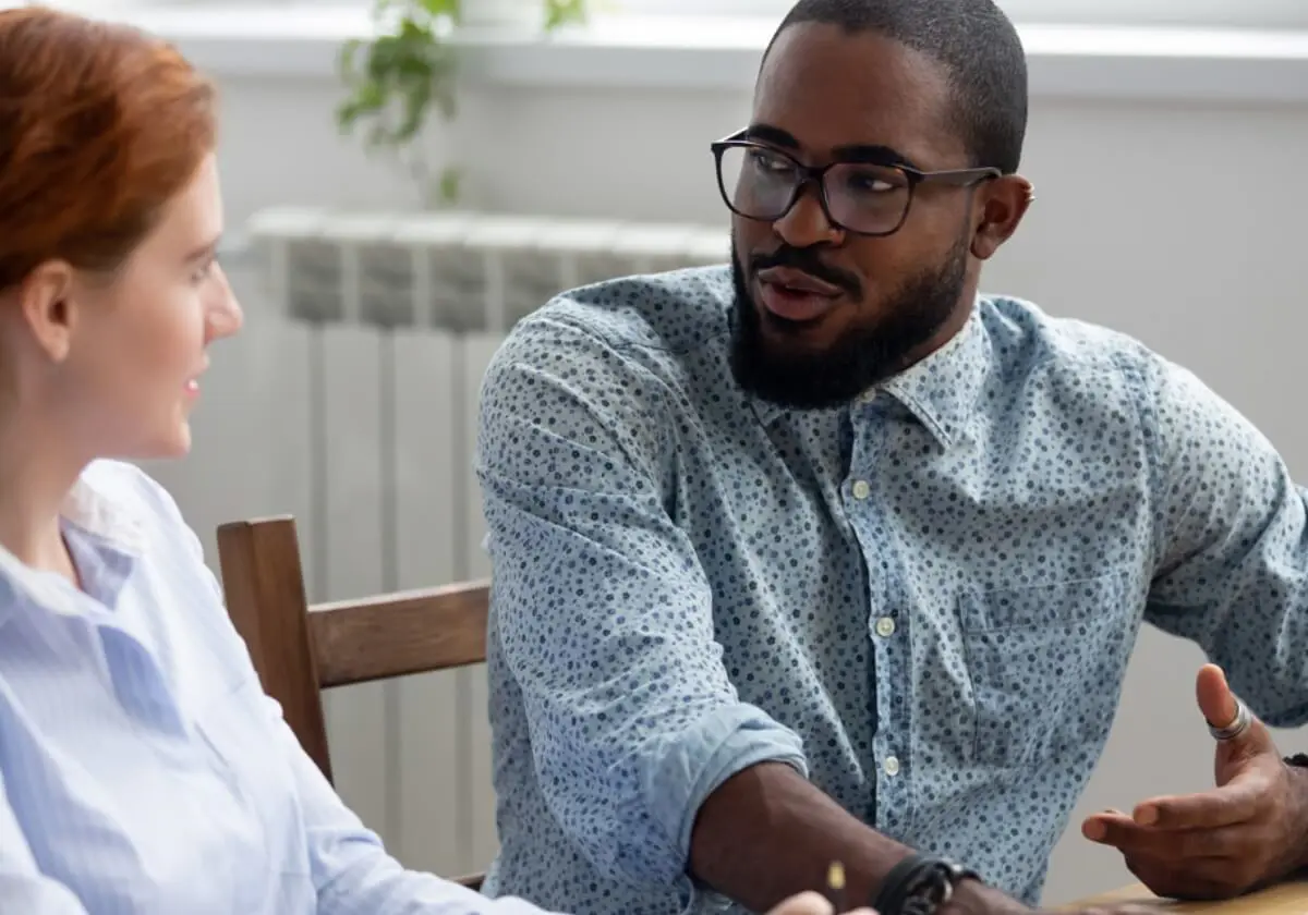 Two Family Resource Center professionals in conversation.