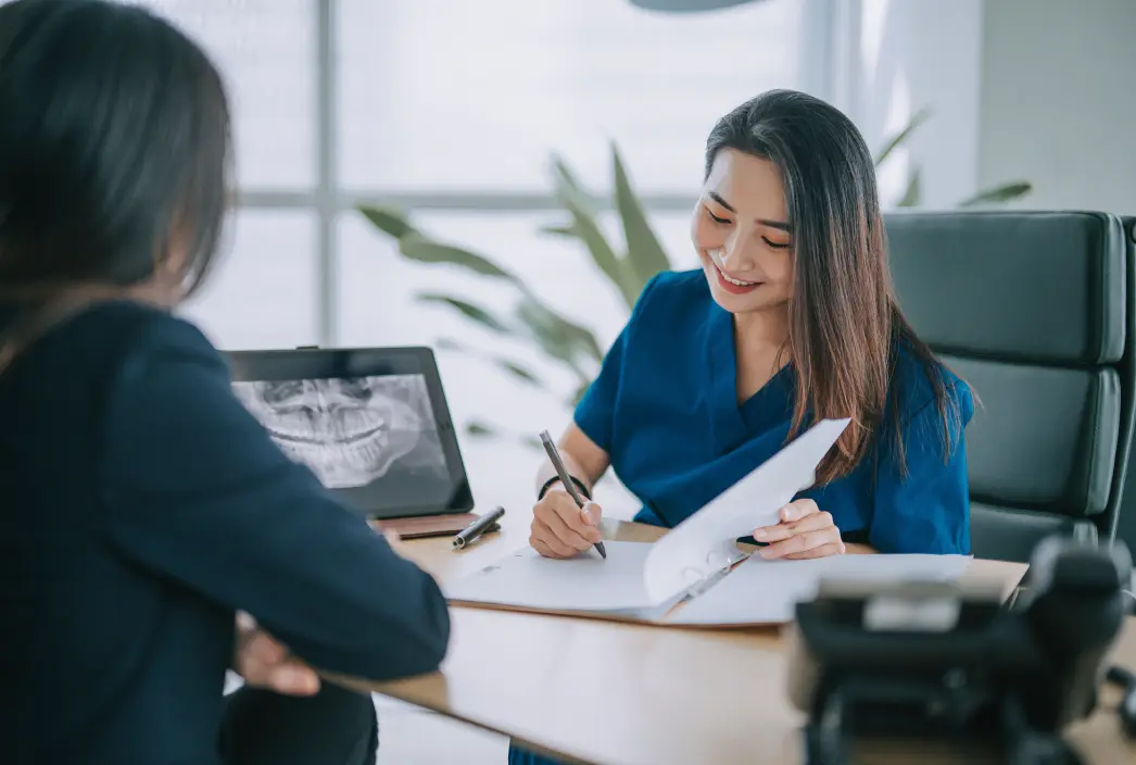 A billing specialist helping a patient with financing.