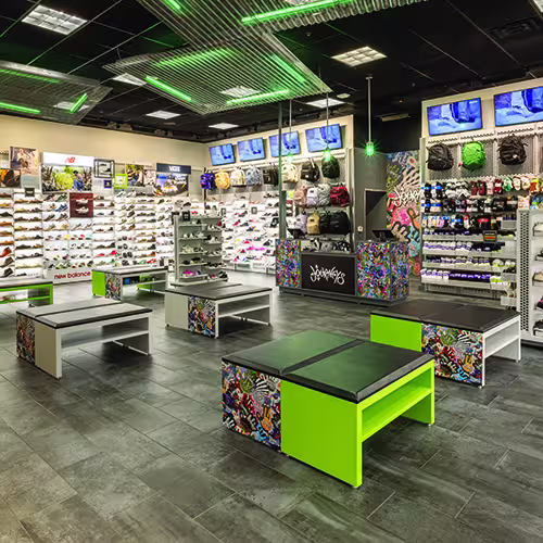 The engaging front of Journeys, one of the Genesco brands, in a brightly lit mall.