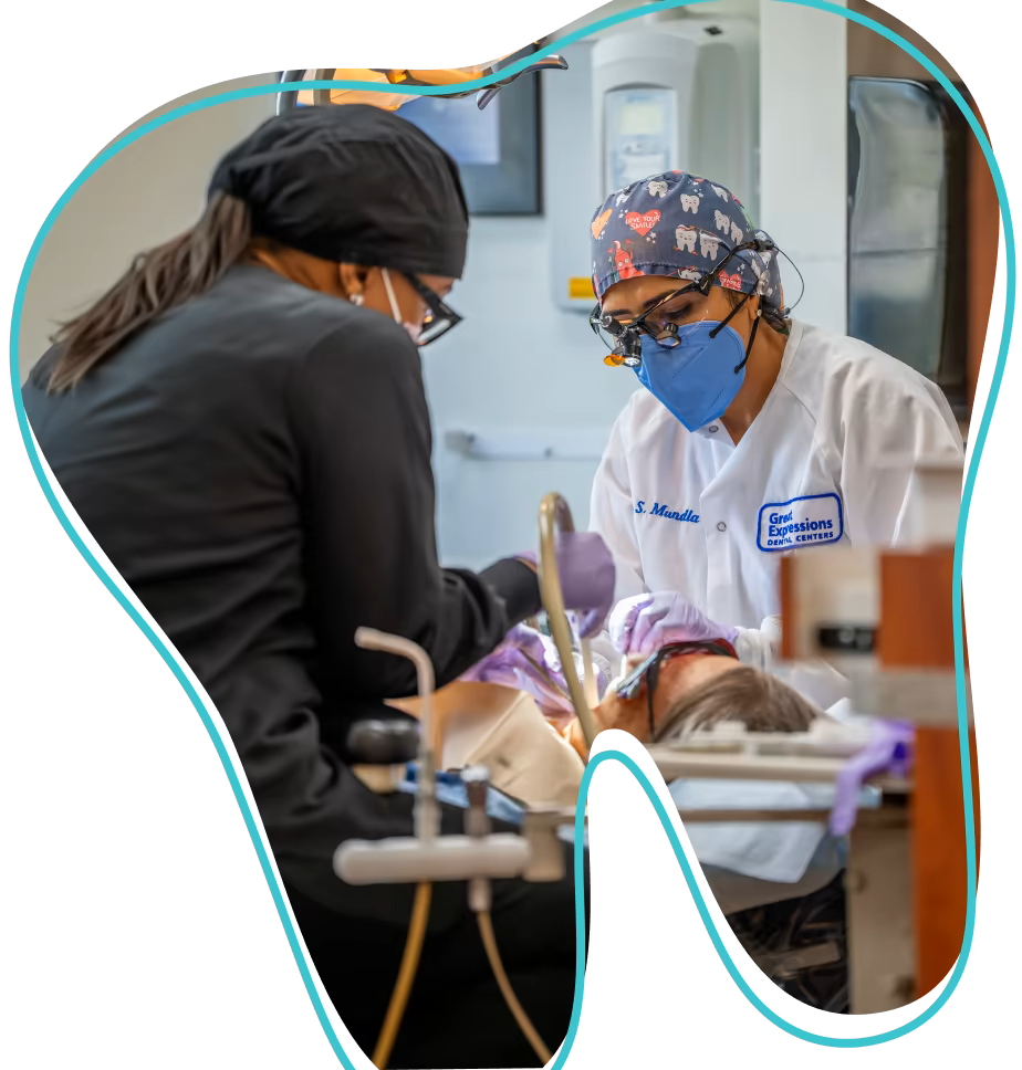 Dental assistant helping a dentist during a procedure.