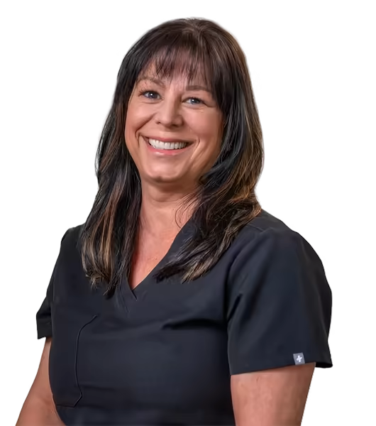 Happy dental hygienist in black scrubs.