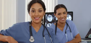 Two smiling UK King’s Daughters clinical professionals.