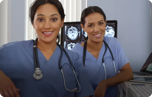 Two smiling UK King’s Daughters clinical professionals.