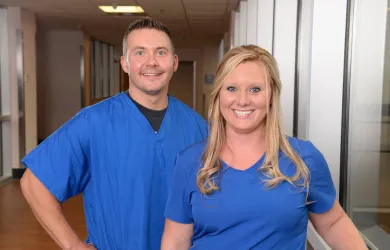 Two UK King’s Daughters nursing team members smiling together.