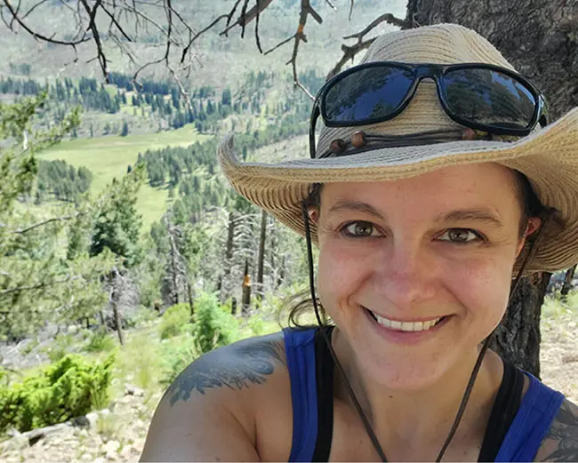 LANL employee, Tessa, smiling on a hike.