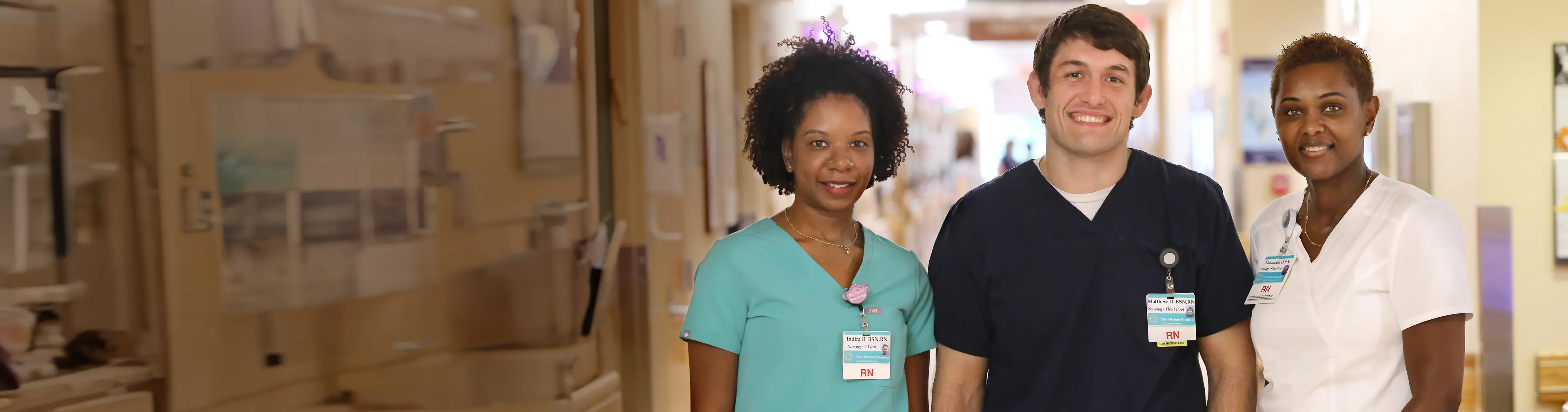 A group of Brown University Health team members smiling.