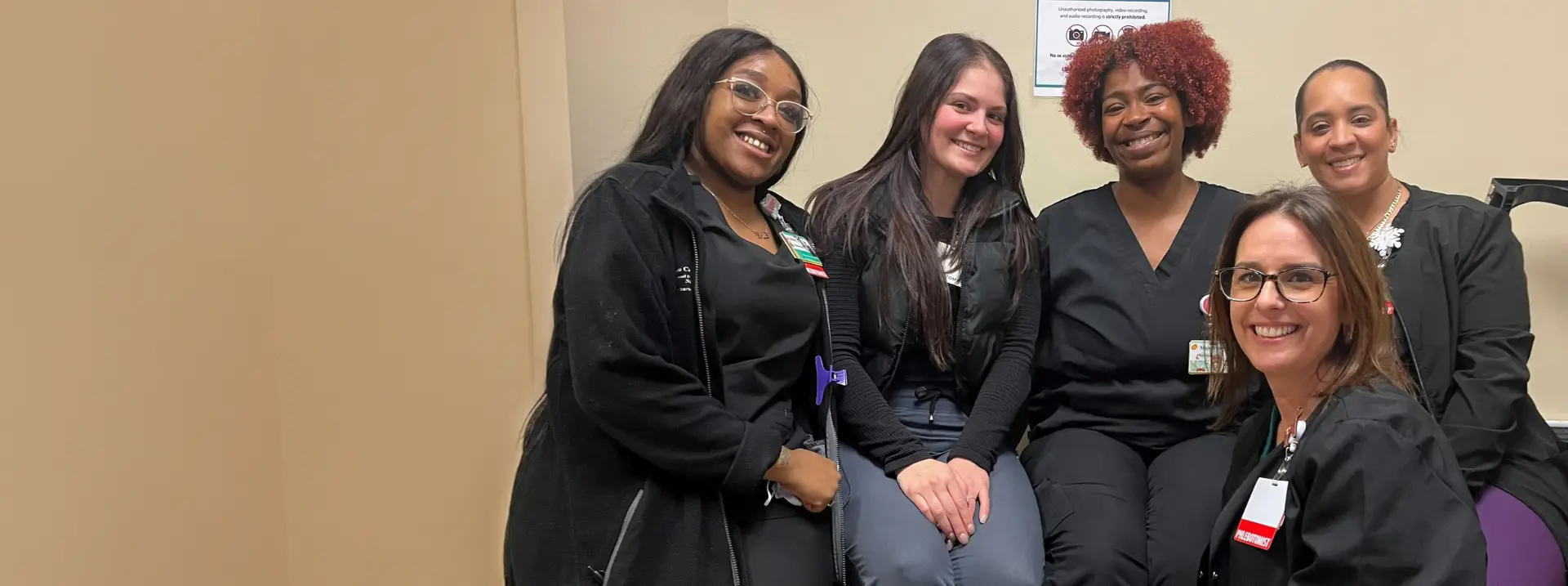 A group of Brown University Health team members smiling.