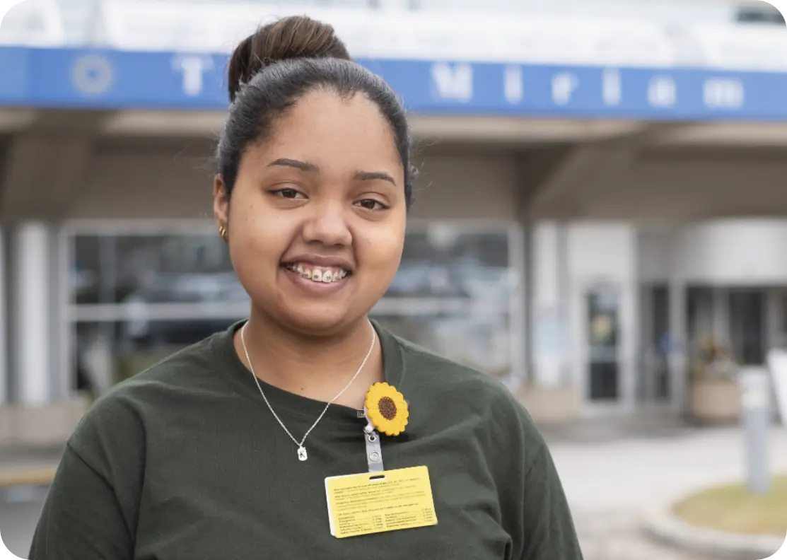 A Brown University Health employee smiling.