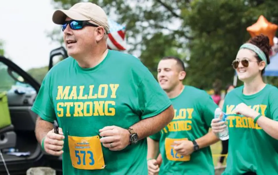 A group of Brown University Health employees participating in a charity race.