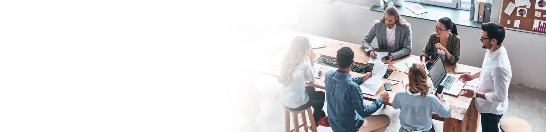 A group working together at a conference table.