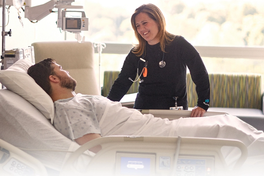 MetroHealth nurse at a patient’s bedside