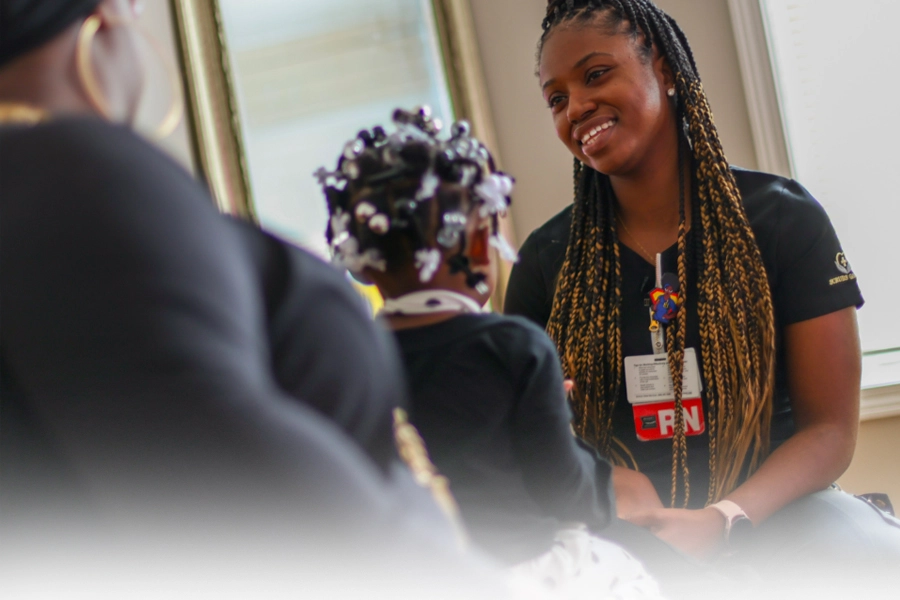 MetroHealth nurse consulting with a mother and daughter