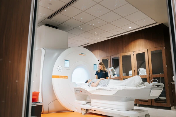 radiologist performing an MRI scan on a patient