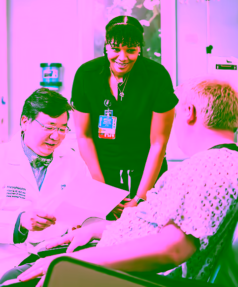 Doctor and nurse working talking with patient in hospital room