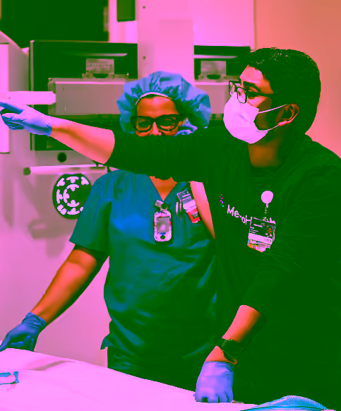 Respiratory therapist and associate working together in hospital room