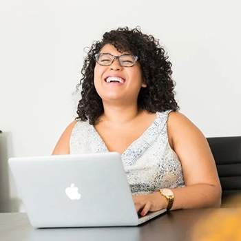 Employees team building in a tug-of-war match.