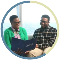 Two NFA interns laughing together.