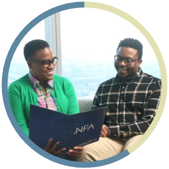Two NFA interns laughing together.
