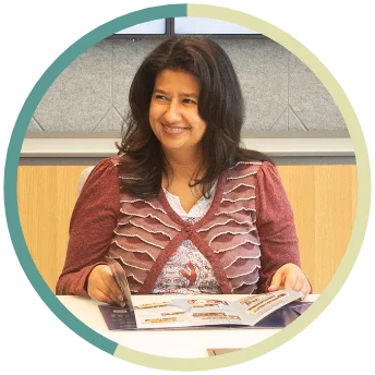 An NFA employee sitting at a conference room table.