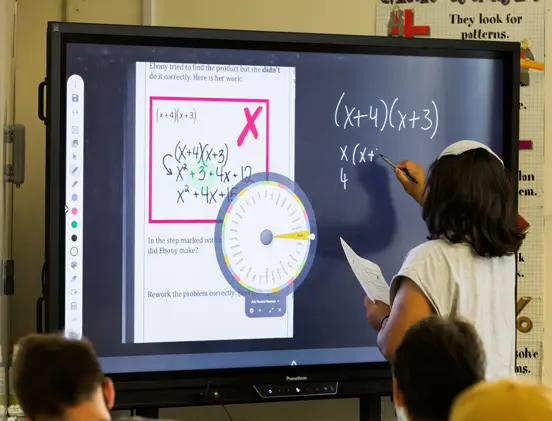 Student using interactive display board